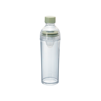 A slim, clear plastic portable matcha bottle by HARIO featuring a light green cap and an internal white mesh filter, isolated on a white background.